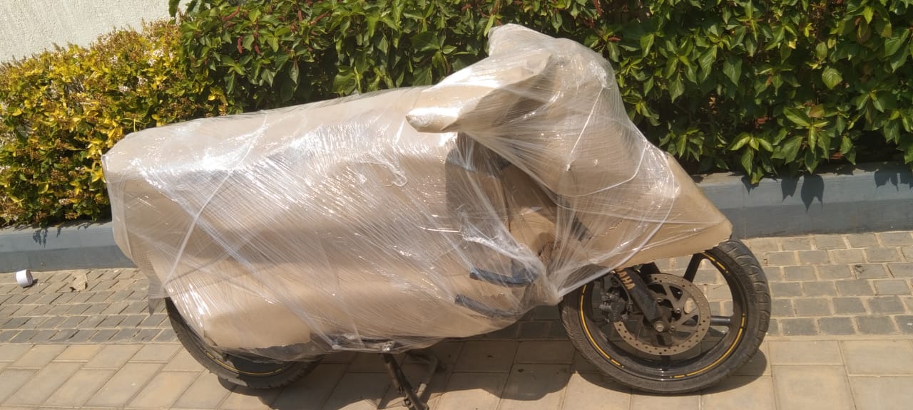 Professional packers carefully wrapping household items